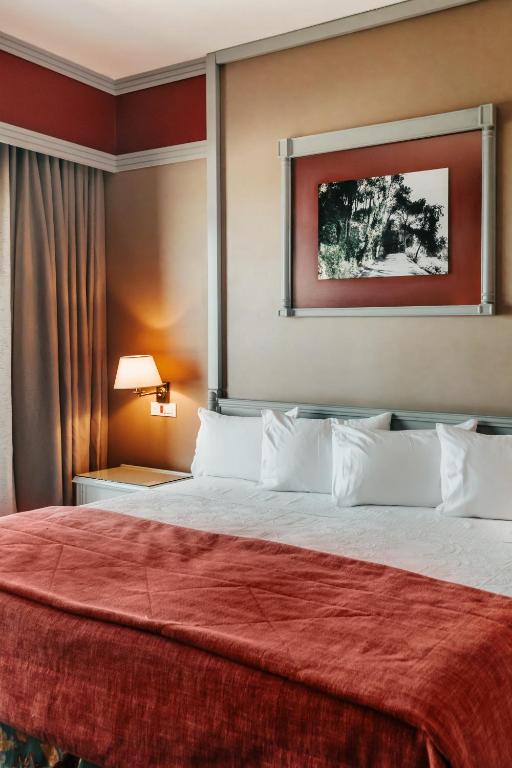 Postel nebo postele na pokoji v ubytování Printania Palace Hotel