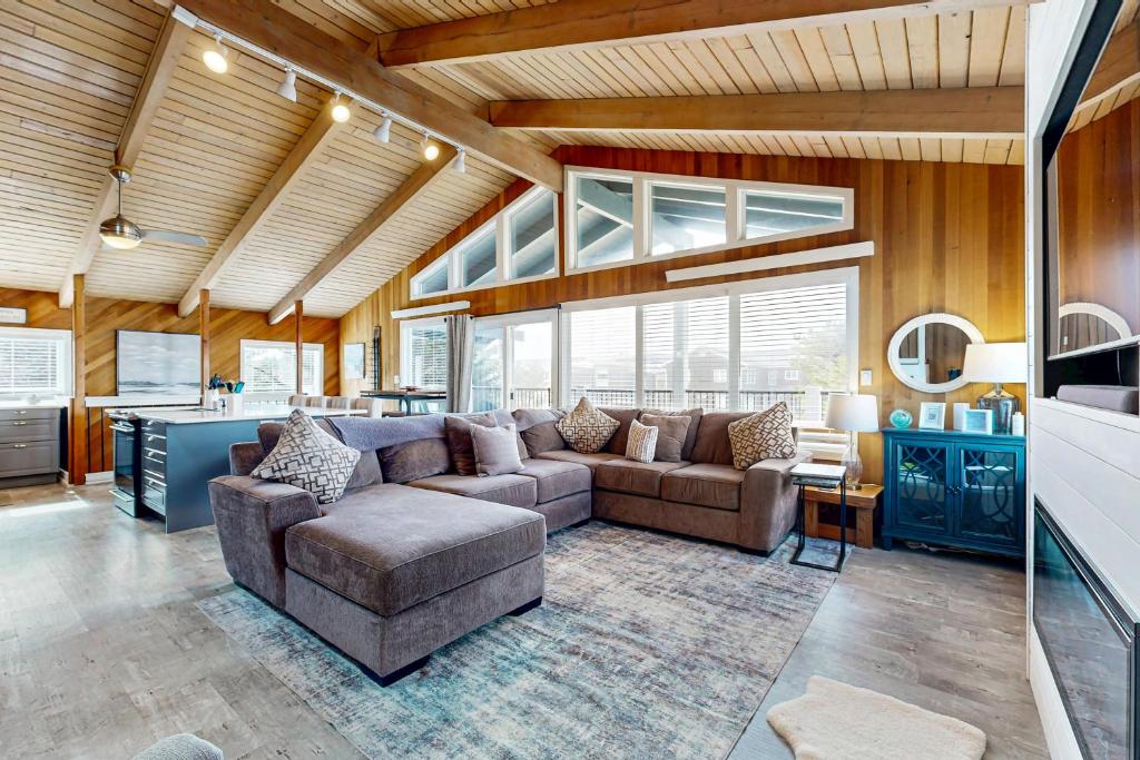 a living room with a couch and a table at The Sand Ranch in Rockaway Beach
