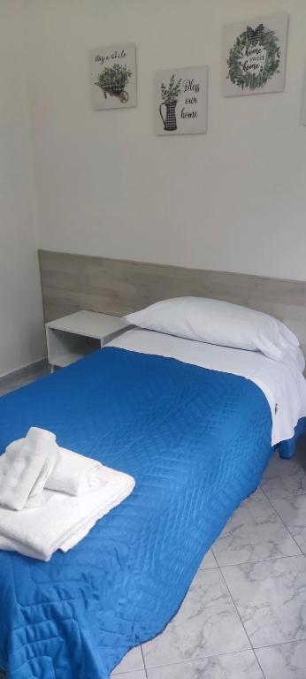 A bed or beds in a room at Il Cortile