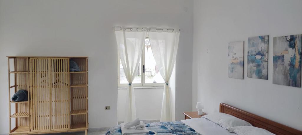 A bed or beds in a room at Il Cortile