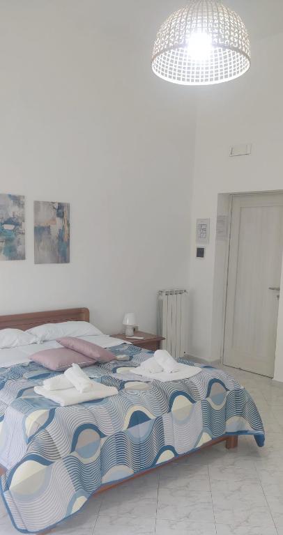 A bed or beds in a room at Il Cortile