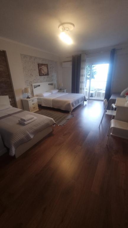 Postel nebo postele na pokoji v ubytování Hotel Klironomi