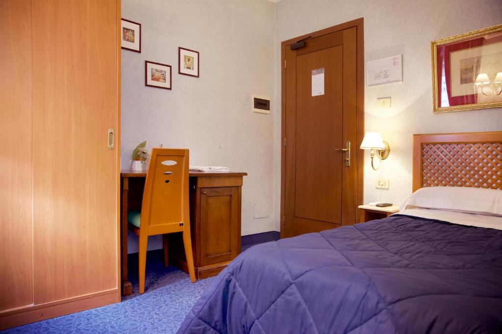 Postel nebo postele na pokoji v ubytování Hotel Silva