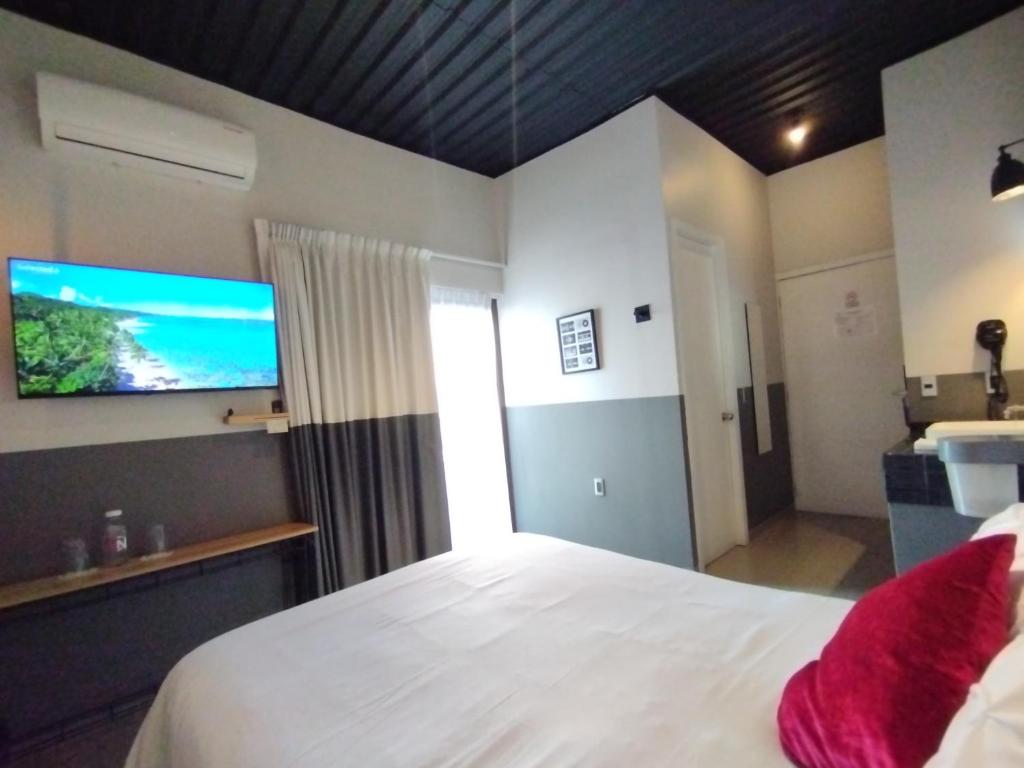 Ένα ή περισσότερα κρεβάτια σε δωμάτιο στο Hotel NEXT