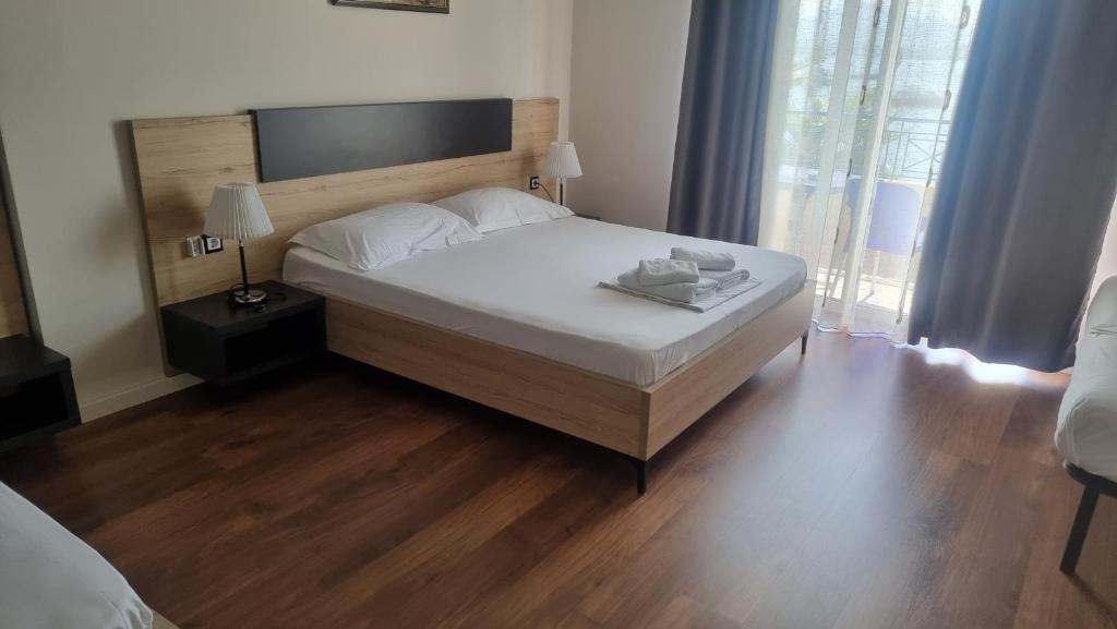 Postel nebo postele na pokoji v ubytování Hotel Klironomi