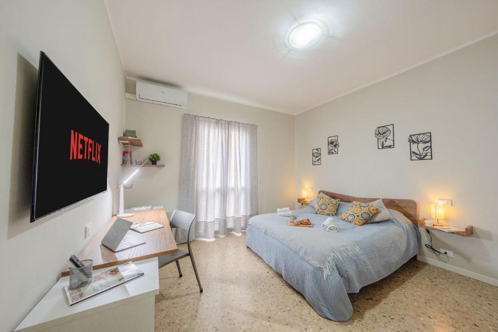 En eller flere senge i et værelse på Italian Experience- Lory House