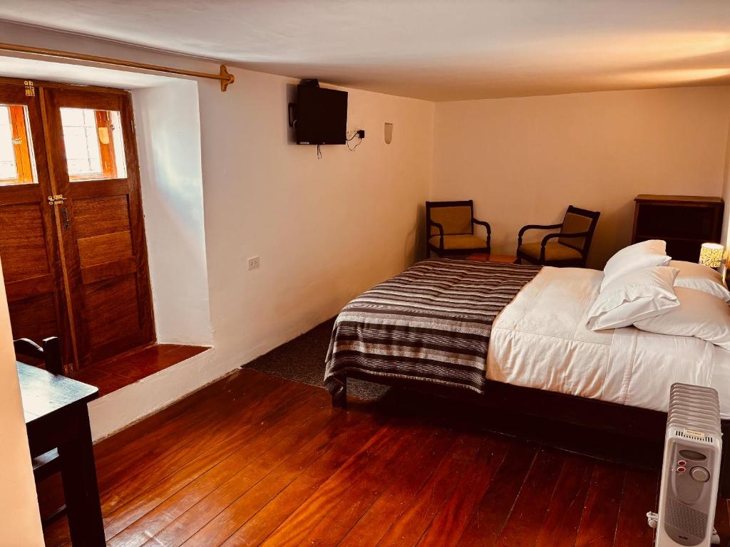 Postel nebo postele na pokoji v ubytování SAMANA B&B
