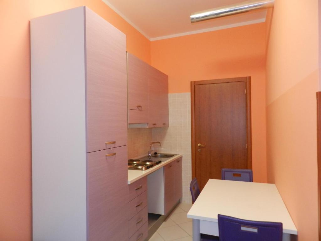 A kitchen or kitchenette at Appartamenti Valdocco