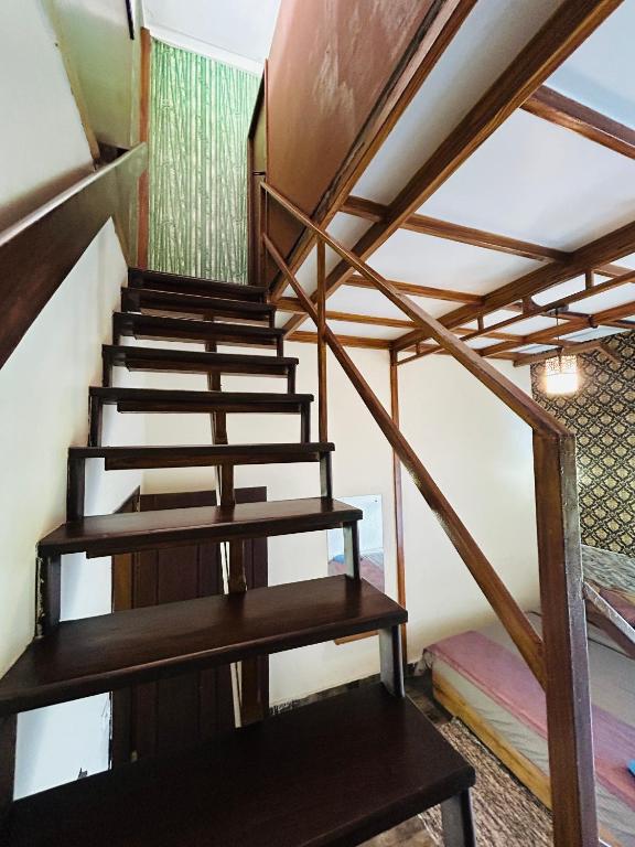 Uma ou mais camas em beliche num quarto em Coorg Sana Riverside