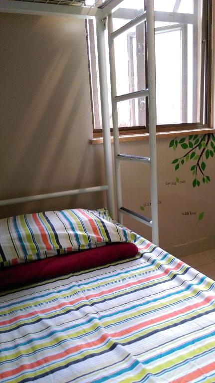 Letto o letti in una camera di YHA Ngong Ping SG Davis Youth Hostel