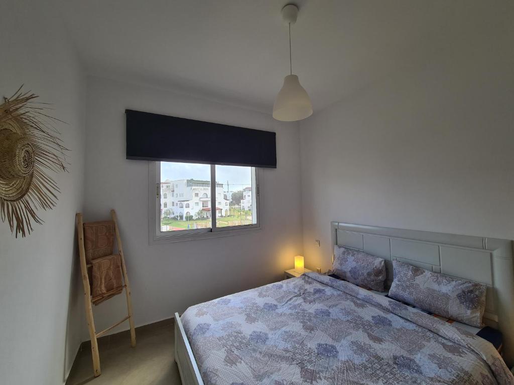 Postel nebo postele na pokoji v ubytování Charmant appartement en résidence piscine