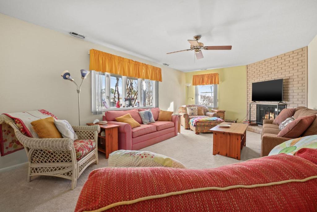 a living room filled with furniture and a fire place at Highlander - Quiet vacation comfort! in Deep Hole