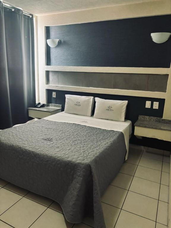 Postel nebo postele na pokoji v ubytování Hotel Union Guadalajara