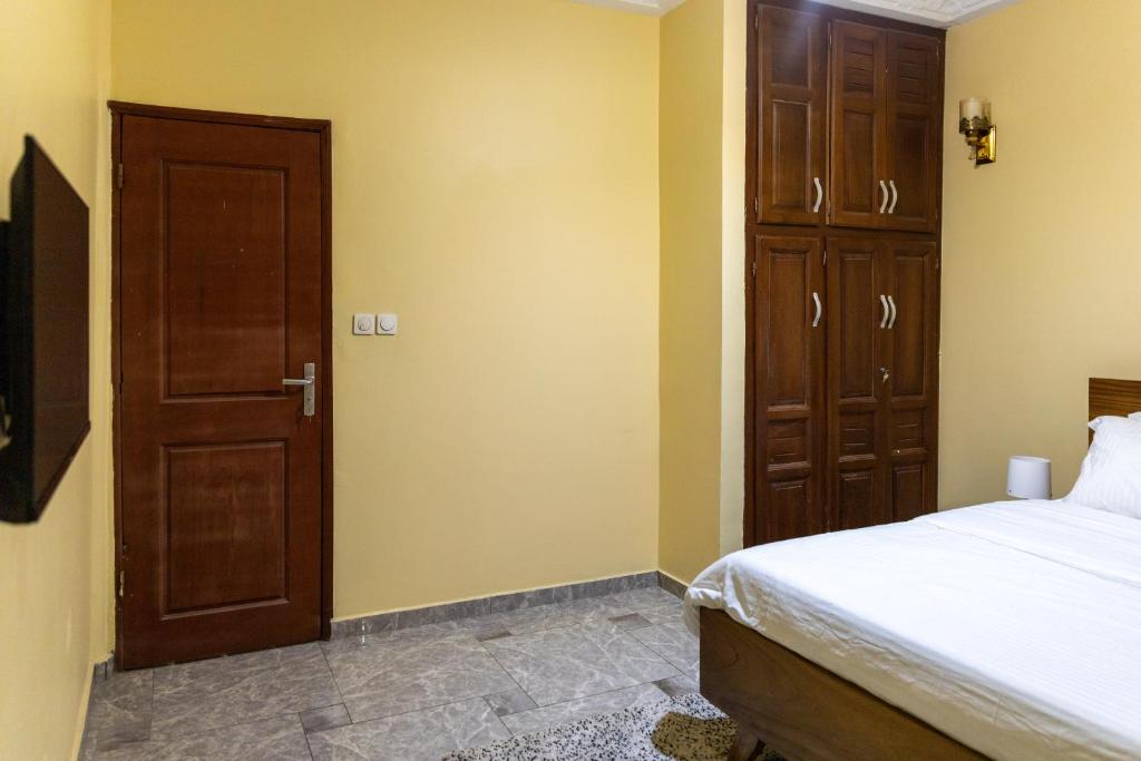 Postel nebo postele na pokoji v ubytování High-end 2BR apartment in the heart of Yaoundé