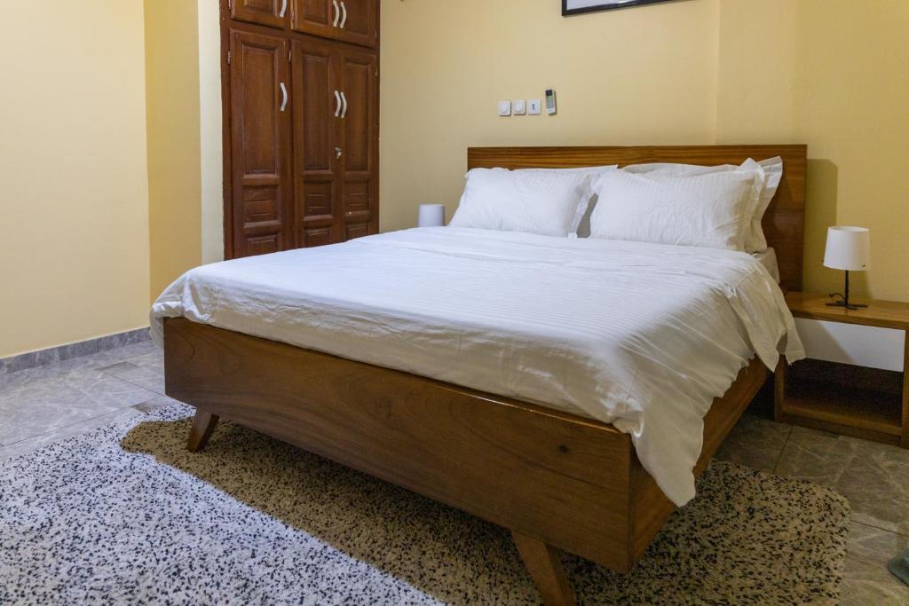 Postel nebo postele na pokoji v ubytování High-end 2BR apartment in the heart of Yaoundé