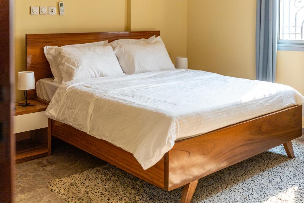 Postel nebo postele na pokoji v ubytování High-end 2BR apartment in the heart of Yaoundé