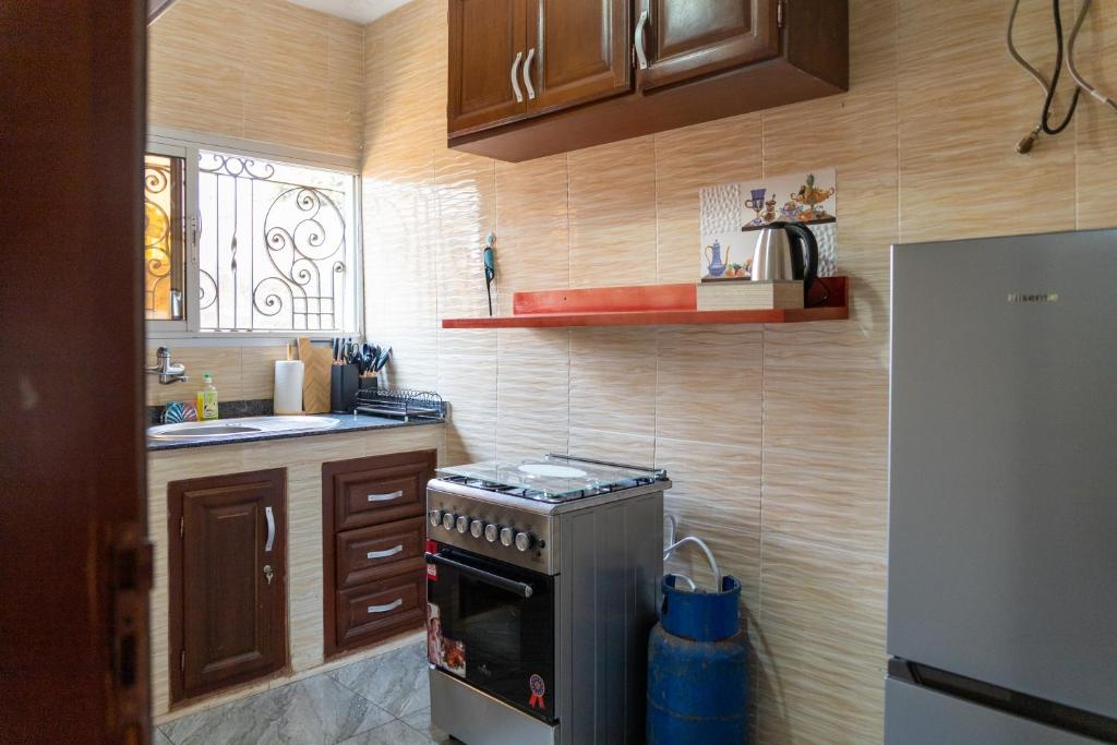 Kuchyň nebo kuchyňský kout v ubytování High-end 2BR apartment in the heart of Yaoundé