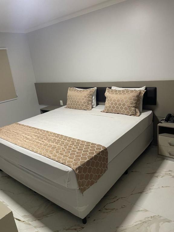Postel nebo postele na pokoji v ubytování Hotel Uipi