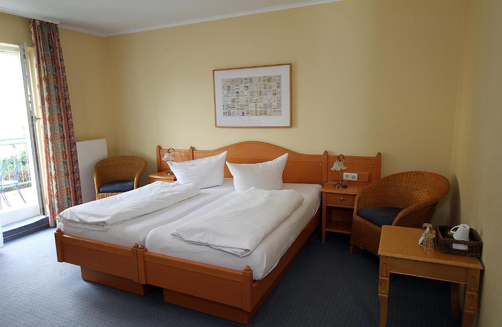 Postel nebo postele na pokoji v ubytování Hotel Lindemann