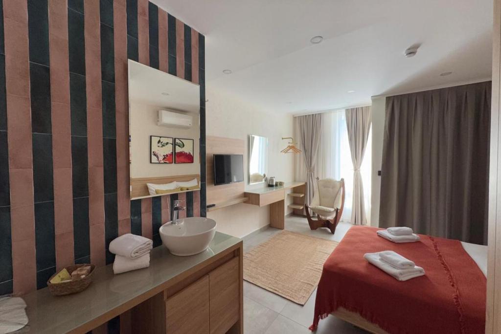 Postel nebo postele na pokoji v ubytování Uva Rooms