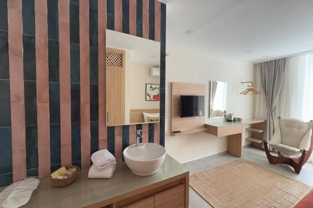 TV a/nebo společenská místnost v ubytování Uva Rooms