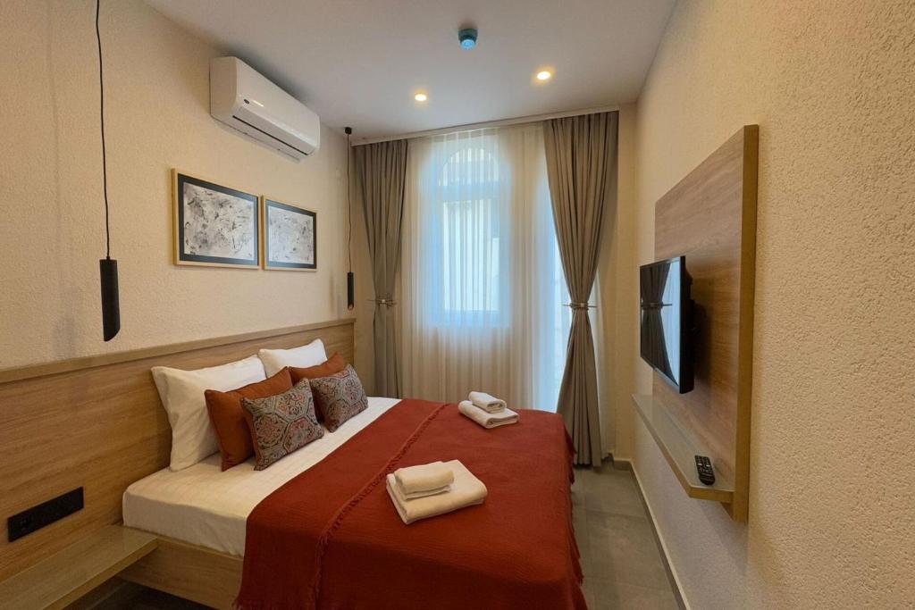 Postel nebo postele na pokoji v ubytování Uva Rooms