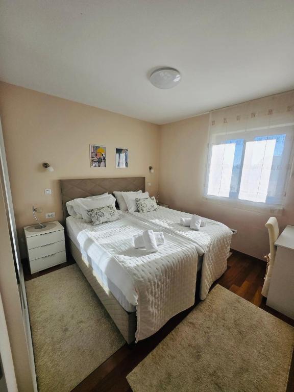 Posteľ alebo postele v izbe v ubytovaní Apartments Luana with private jacuzzi