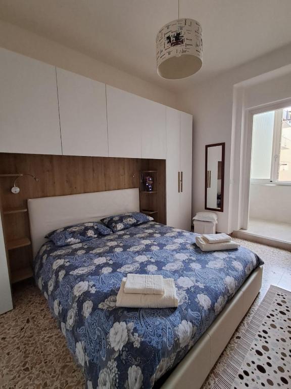 Postel nebo postele na pokoji v ubytování Camera Alghero Centro
