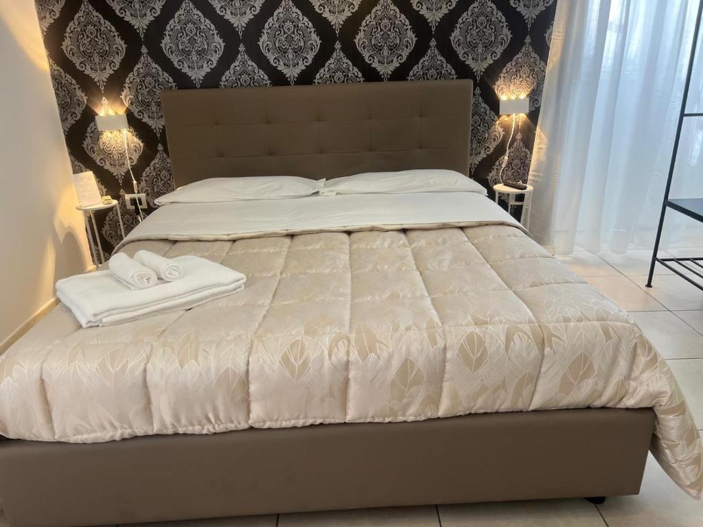 Łóżko lub łóżka w pokoju w obiekcie Suite Contè Poderico
