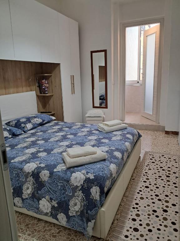 Postel nebo postele na pokoji v ubytování Camera Alghero Centro