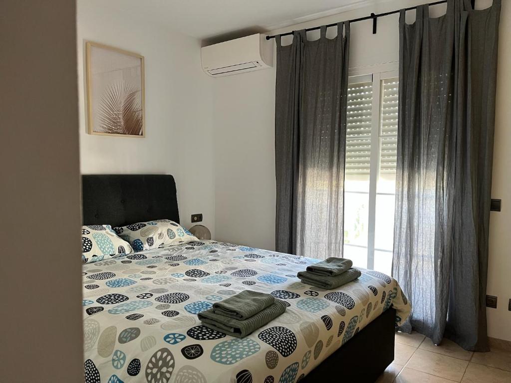 Posteľ alebo postele v izbe v ubytovaní NERJA 4
