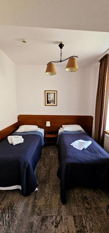 Postel nebo postele na pokoji v ubytování Hotel Siesta
