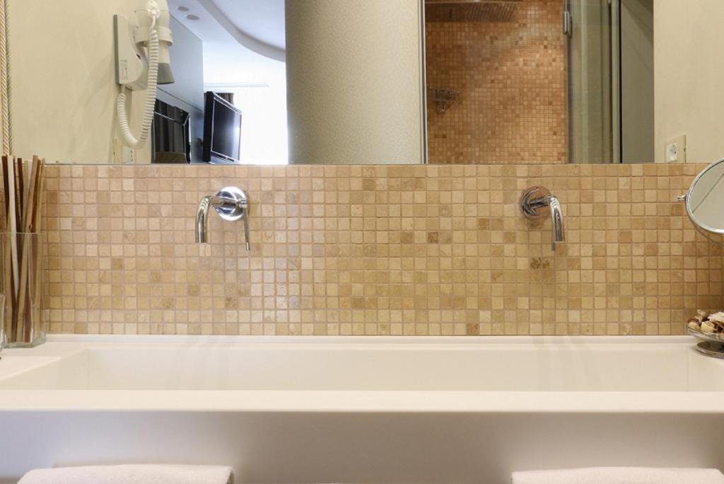 Koupelna v ubytování Hotel degli Amici