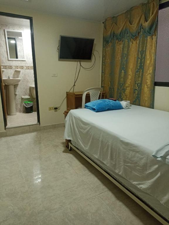 Postel nebo postele na pokoji v ubytování Hotel San Vicente