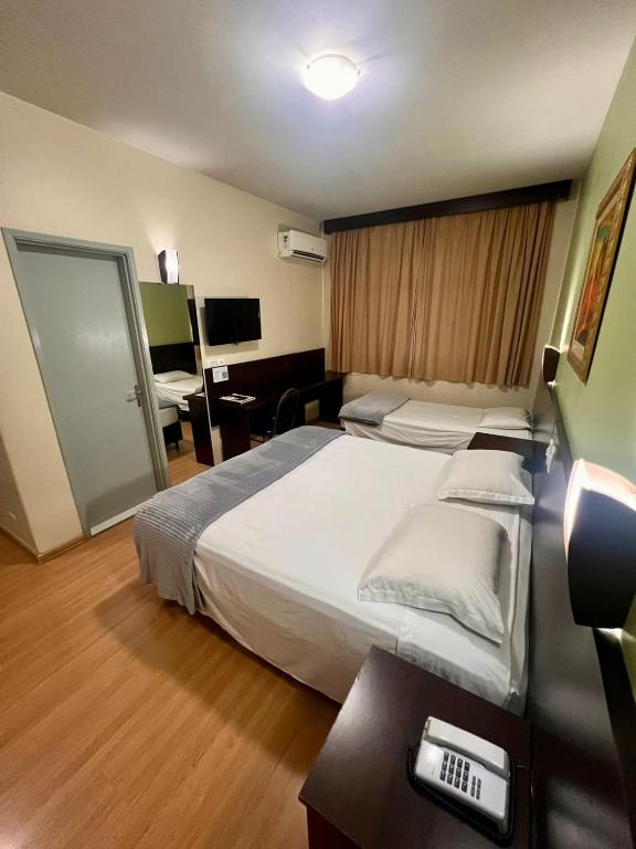 Postel nebo postele na pokoji v ubytování Dom Pedro I Palace Hotel