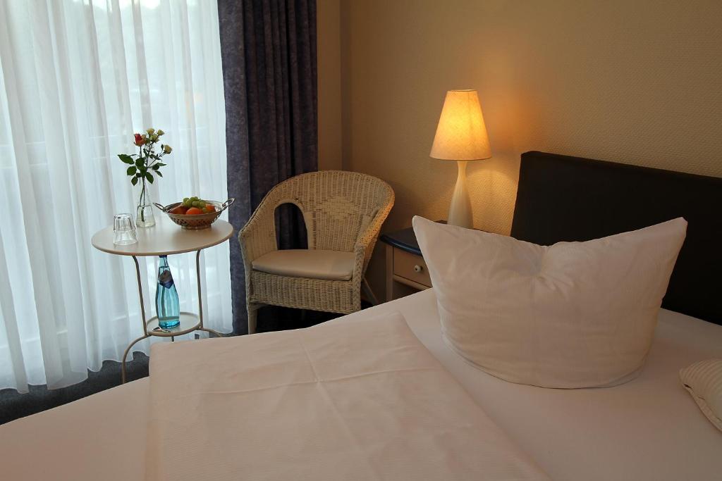 Postel nebo postele na pokoji v ubytování Hotel Lindemann