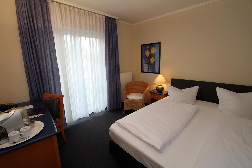 Postel nebo postele na pokoji v ubytování Hotel Lindemann
