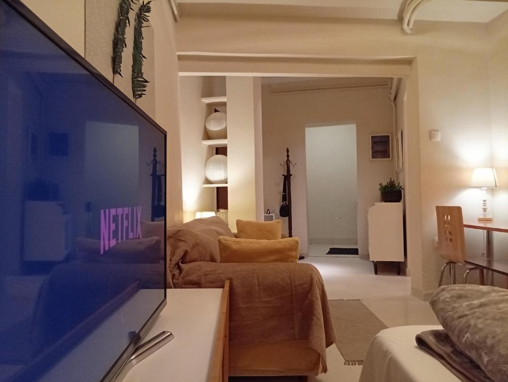 A television and/or entertainment centre at Zacharitsa APT at Acropolis up 4 guests by LODGESPOT