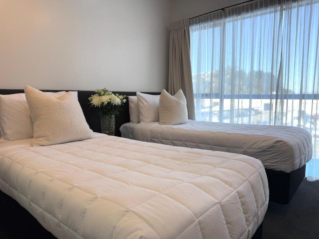Postel nebo postele na pokoji v ubytování Bluewater Hotel