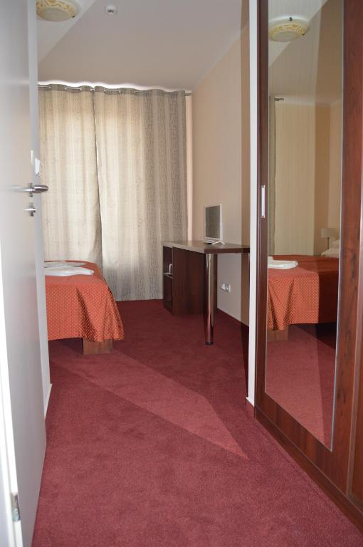 Postel nebo postele na pokoji v ubytování HOTEL ARÉNA