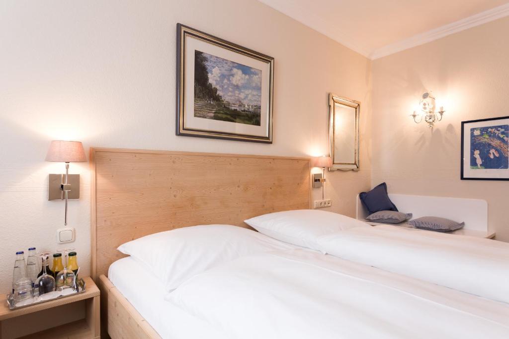 Postel nebo postele na pokoji v ubytování Hotel Sollner Hof