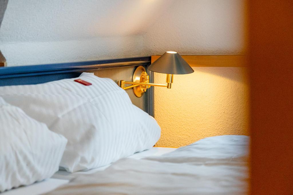 Postel nebo postele na pokoji v ubytování Hotel Up´n Diek