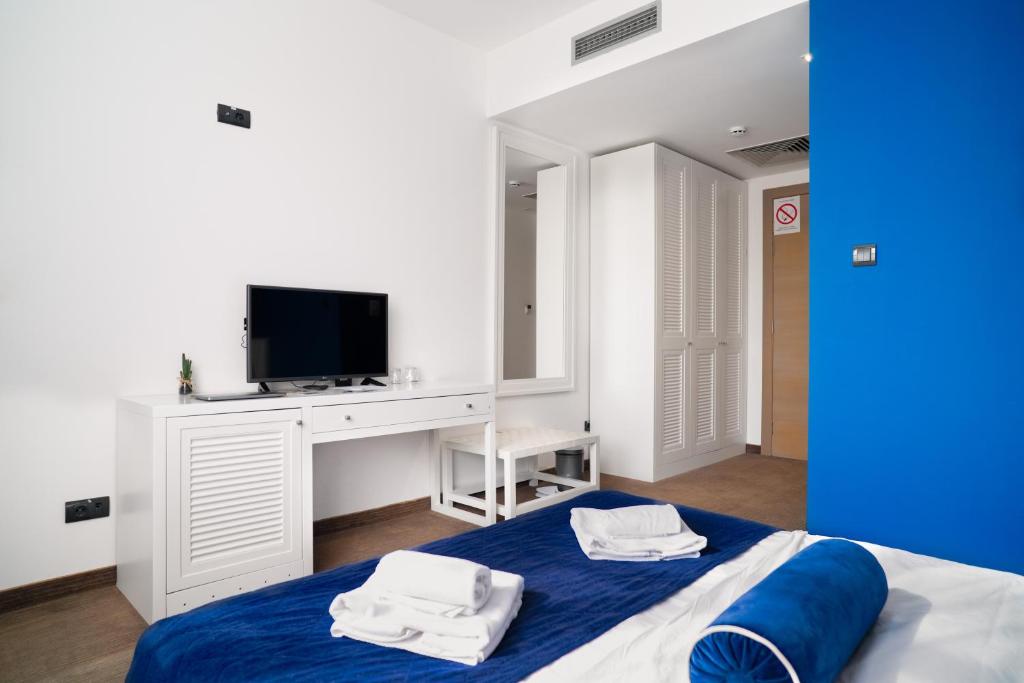 Postel nebo postele na pokoji v ubytování Hotel Passport