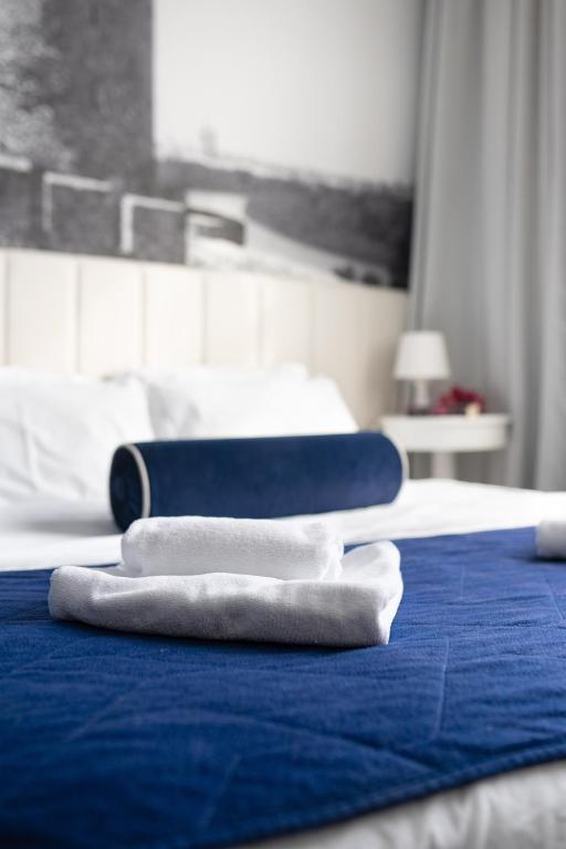 Postel nebo postele na pokoji v ubytování Hotel Passport