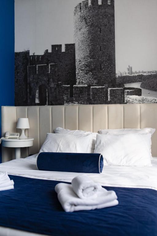 Postel nebo postele na pokoji v ubytování Hotel Passport