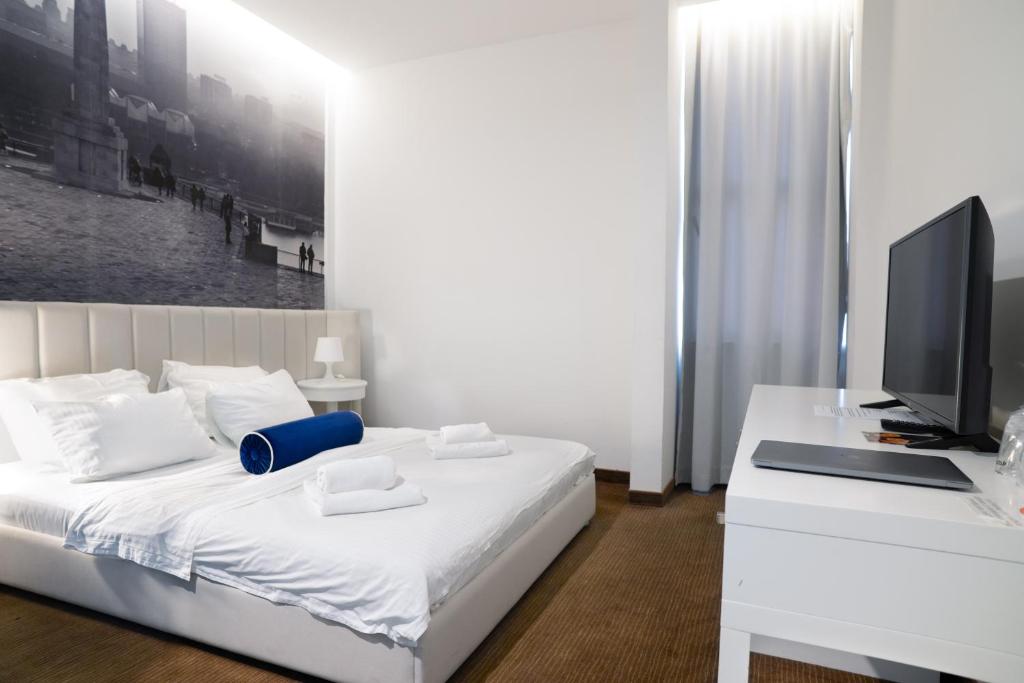 Postel nebo postele na pokoji v ubytování Hotel Passport