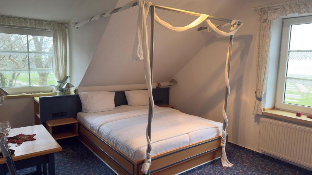 Postel nebo postele na pokoji v ubytování Hotel Up´n Diek