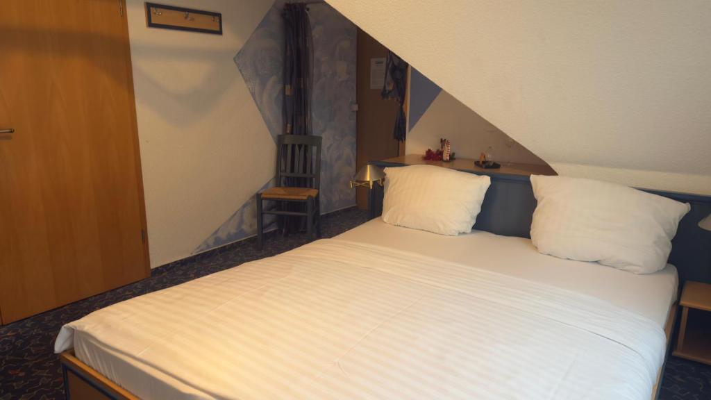 Postel nebo postele na pokoji v ubytování Hotel Up´n Diek