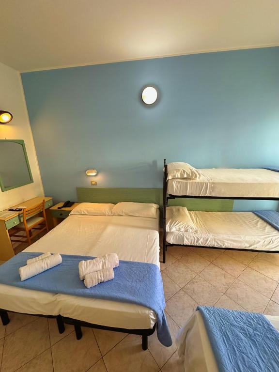 Postel nebo postele na pokoji v ubytování Hotel Sant'Angelo