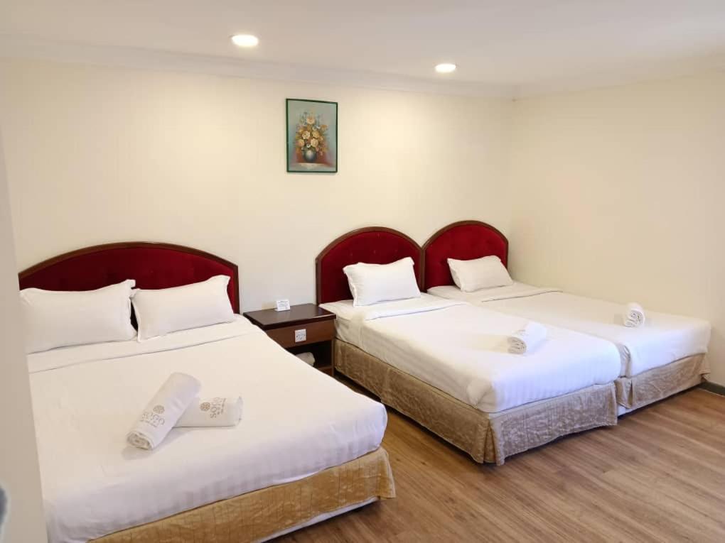 Postel nebo postele na pokoji v ubytování Sogo Hotel 2